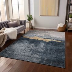 a living room with a couch, chair and rug