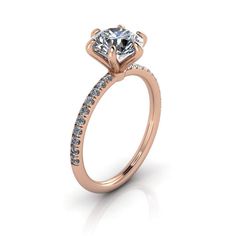 a rose gold engagement ring with diamonds on the side