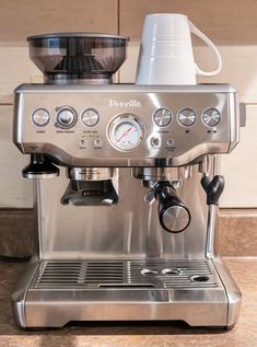 an espresso machine sitting on top of a counter