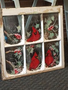 a window with red birds painted on it