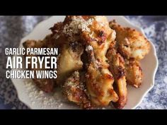 garlic parmesan air fryer chicken wings on a white plate