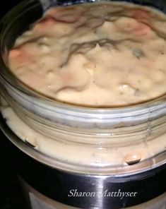 a jar filled with food sitting on top of a stove