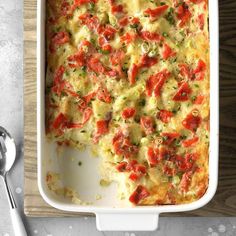 a casserole dish with tomatoes and cheese