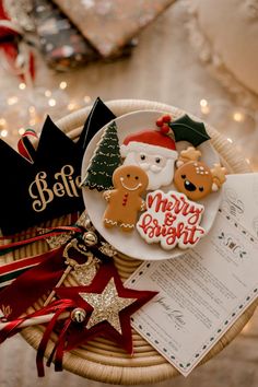 a plate with some christmas cookies on top of it next to other decorations and gifts