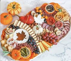 a heart shaped platter filled with different types of food