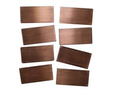 six pieces of brown metal on a white background