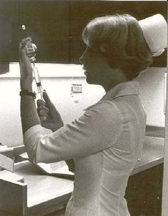 a woman is holding a baseball bat in her hand