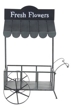 a black and white cart with a sign that says fresh flowers on the front side