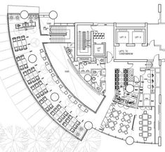 the floor plan for an office building, with several tables and seating areas in it