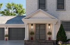 the front of a house with two garages