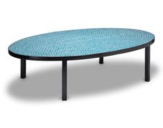 an oval table with black legs and blue mosaic tile on the top, against a white background