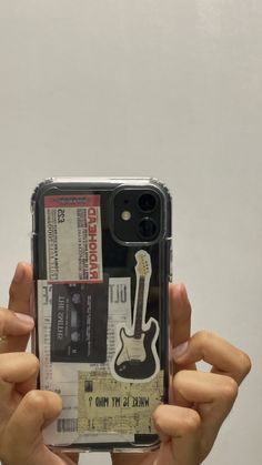 someone is holding up their phone case to take a photo