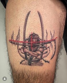 a man's leg with a tattoo on it and an arrow in the middle