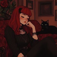 a woman with red hair sitting on a couch next to a black cat