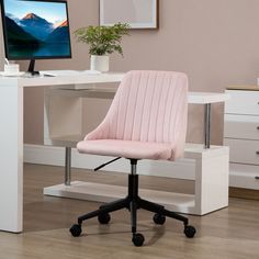 a pink office chair sitting in front of a computer desk with a monitor on it