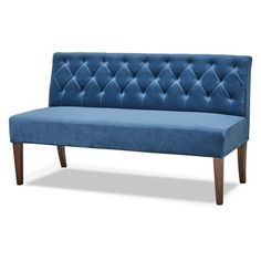 a blue couch sitting on top of a wooden frame