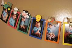 a group of pictures hanging from the side of a wall next to each other with animals on them