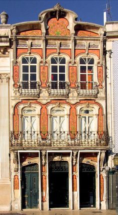 an old building with many windows and balconies