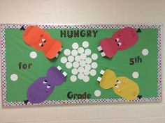 a bulletin board with four different colored gummy bears and the words hungry for 5th grade