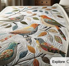 a quilted bed with birds on it and the words explore color written in large letters