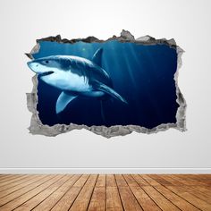 an image of a shark in the ocean through a hole wall sticker on a white wall