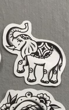 three stickers with an elephant and flowers on them