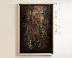 an abstract painting hangs on the wall