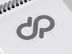 an open spiral notebook with the letter o on it