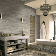 a bathroom with a tub, sink and towel rack