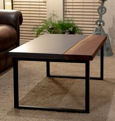 a wooden table sitting on top of a carpeted floor