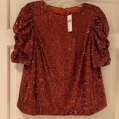 Beautiful Sequin Blouse, One Button Closure In Back At Neck. New With Tags. Beautiful Puff Sleeve That Drape. Size 2, But Roomy For The Size. Perfect For Holidays!! Fall Evening Top With Puff Sleeves, Evening Puff Sleeve Tops For Fall, Fall Party Padded Blouse Top, Fitted Sequin Blouse For Workwear, Puff Sleeve Padded Blouse For Evening, Short Sleeve Blouse For Fall Date Night, Padded Blouse For Fall Party, Short Sleeve Blouse For Date Night In Fall, Glamorous Fitted Blouse With Puff Sleeves