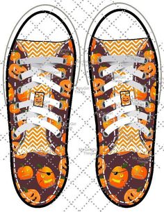 a pair of sneakers decorated with pumpkins and jack - o'- lanternes