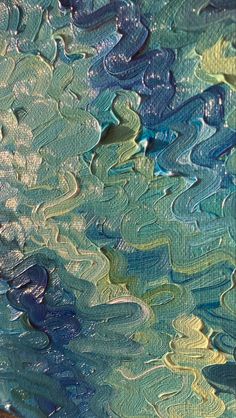 an abstract painting with blue, green and yellow colors on it's surface is shown