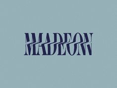 the word madison written in blue ink on a light blue background