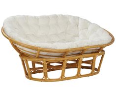 a round wicker chair with white cushions