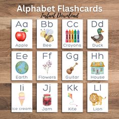 alphabet flashcards with pictures of animals, letters and numbers in them on a wooden surface