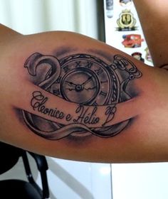 a woman with a tattoo on her arm has a clock and ribbon that says, eleonio e hella