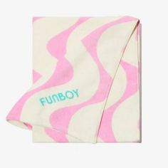 a pink and white zebra print blanket with the word furby printed in blue on it