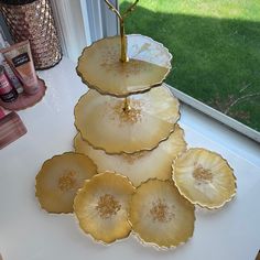 three plates stacked on top of each other in front of a window