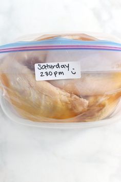 a packaged chicken in a plastic container with a price tag on the label that says, saturday 29pm - 3pm