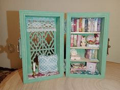 an open book case filled with decorative items