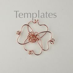 a wire work brooch with the word templates written below it on a white background