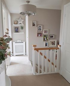 the hallway is clean and ready to be used as a place for pictures on the wall