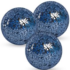 three blue glass balls with white designs on them