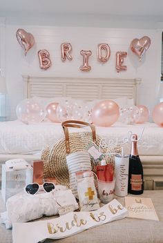 the bridal party is set up with champagne and confetti on the bed