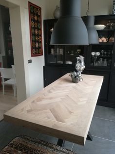 a large wooden table sitting in the middle of a room