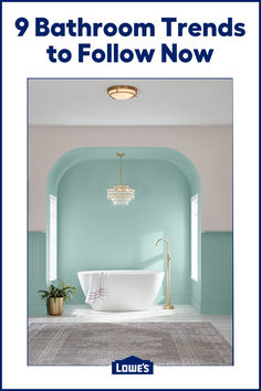 a bathroom with blue walls and a white bathtub in the center, text reads 9 bathroom trends to follow now