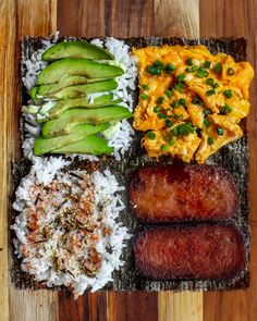 an assortment of sushi on a cutting board