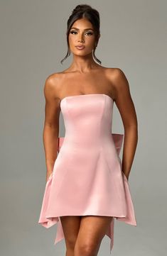 The Freja mini blush dress is party perfection. Crafted in luxurious stretch satin, this beautiful design is strapless with a corseted bodice and flirty, flouncy skirt. A dramatic bow to the back finishes the look. Homecoming Dresses Corset, Blush Dress, Hoco Dress, Strapless Corset, Maxi Dress Sale, Popular Dresses, Blush Dresses, Sparkle Dress, Dresses By Length