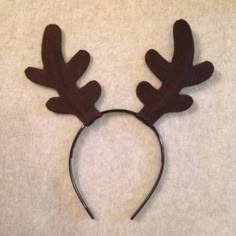 a close up of a headband with antlers on it